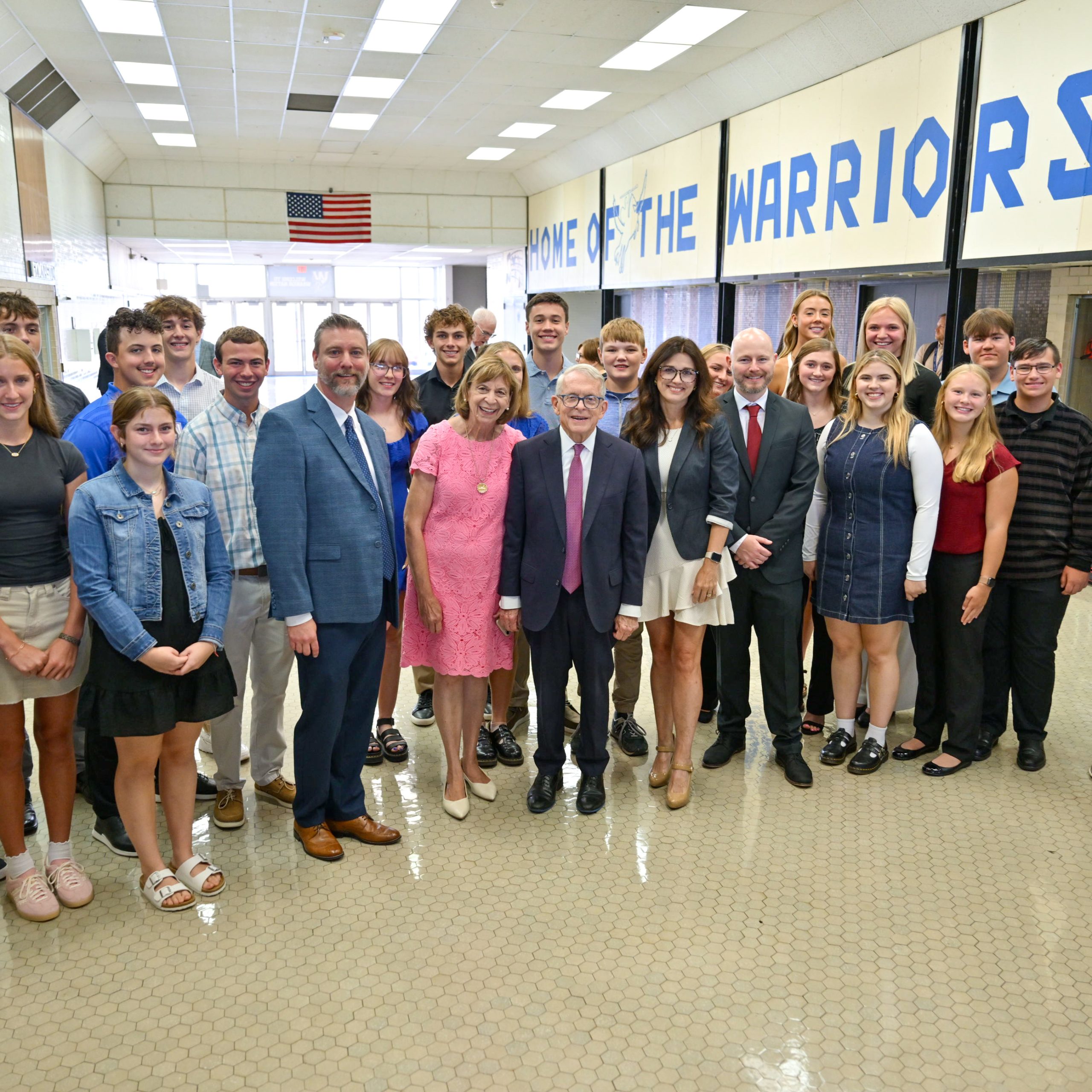 Dewine visiting a school photo with a large group of students and staff.