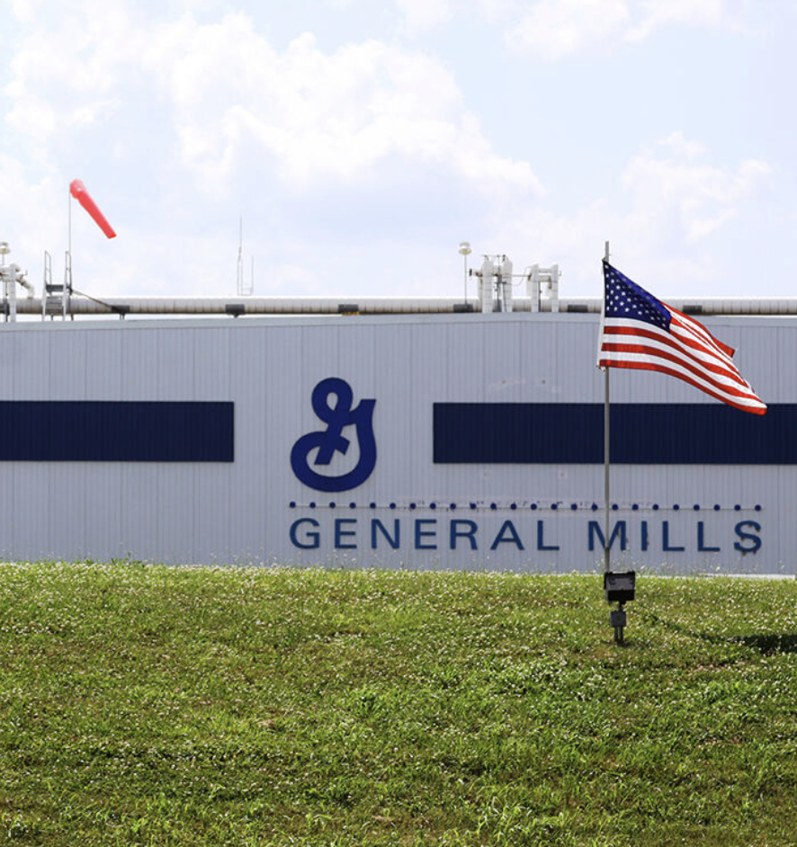 General Mills Factory with American flags.
