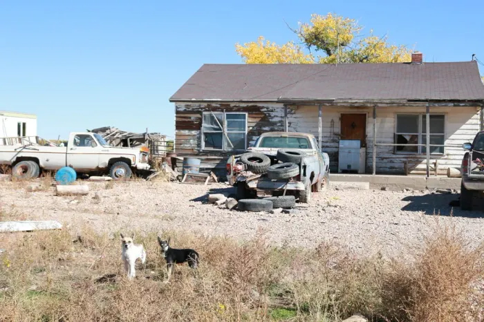Rundown house with rundown truck.
