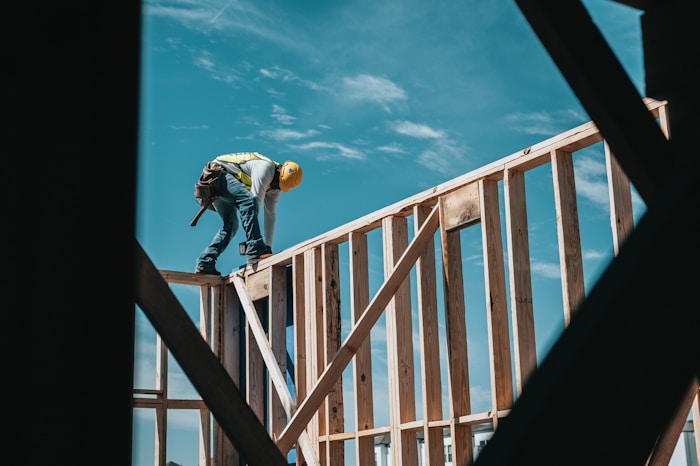 Builder framing a building.